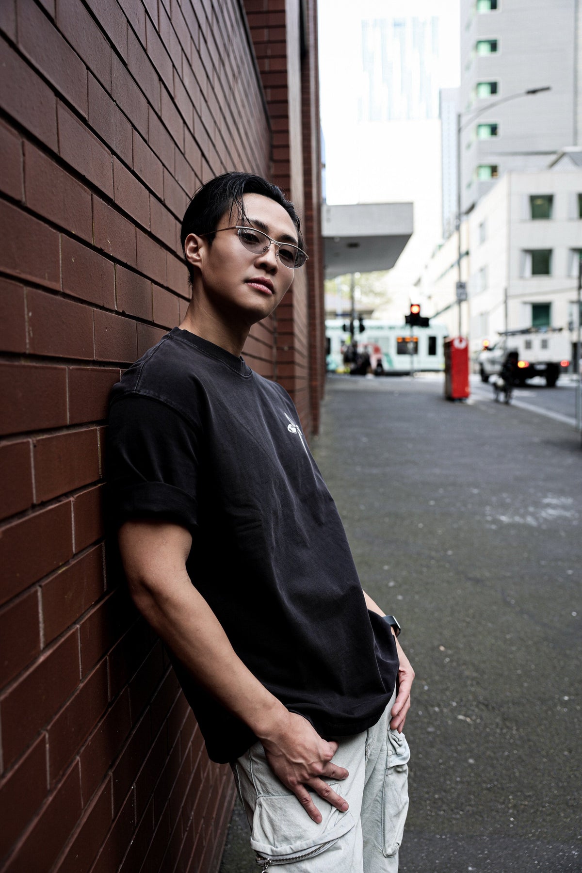 Metallic Cross Tee, oversized fit against brick