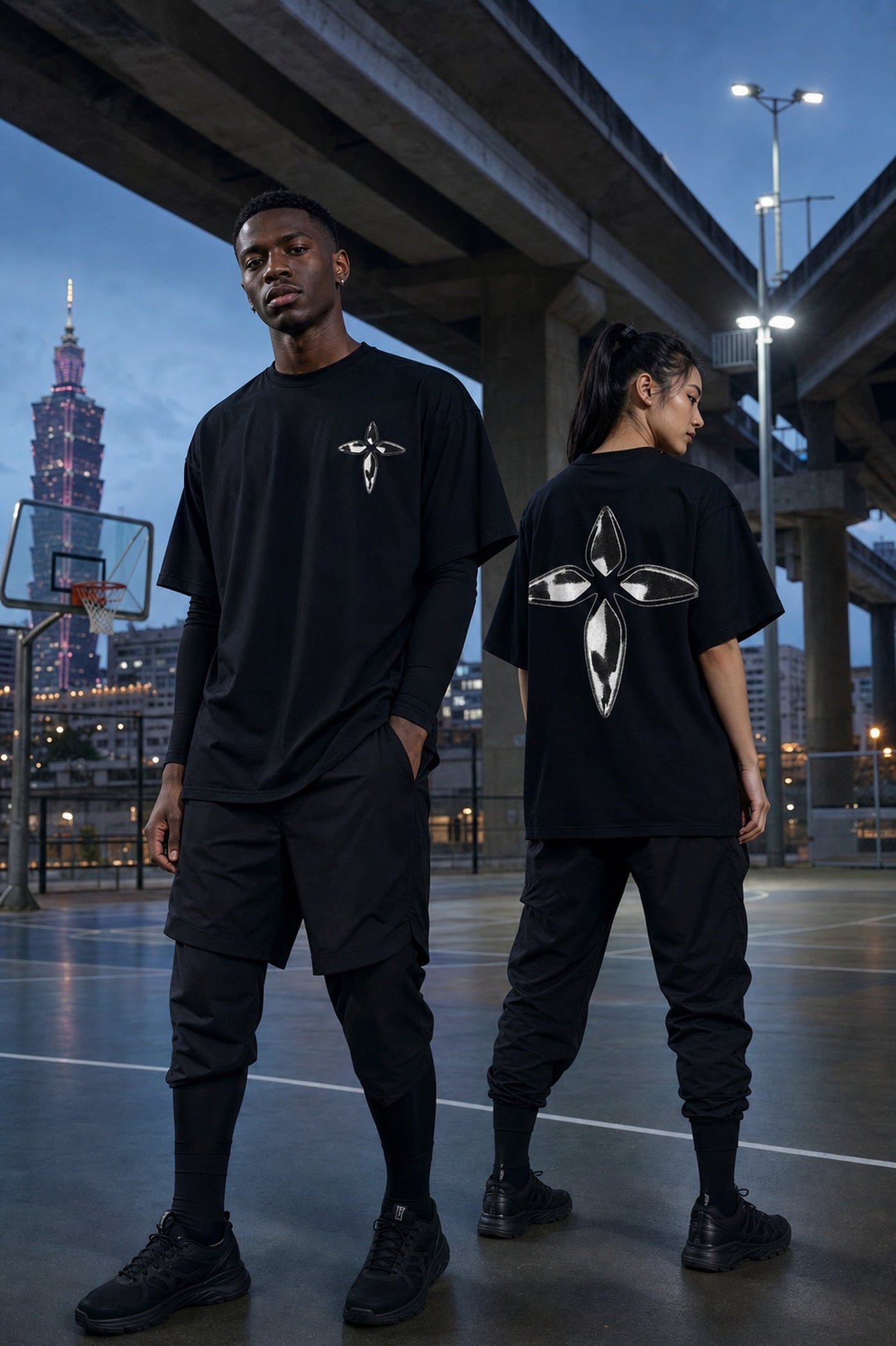 Metallic Cross Tee under the Taipei overpass at dusk, Taipei 101 behind
